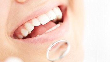 Person receiving a dental checkup in Brick