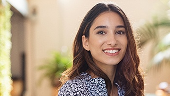 woman smiling after being a good candidate for cosmetic dentistry in Brick Township 