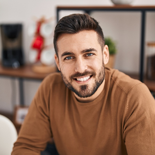 a man smiling with dental crowns in Brick Township 