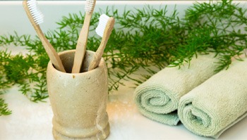 Toothbrushes in a clay cup