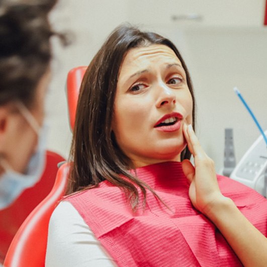 a patient visiting her dentist for tooth extractions