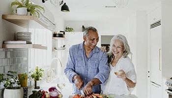 Older couple preparing a meal together
