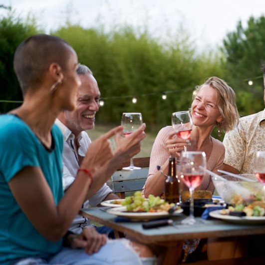 Adult friends enjoying a meal together