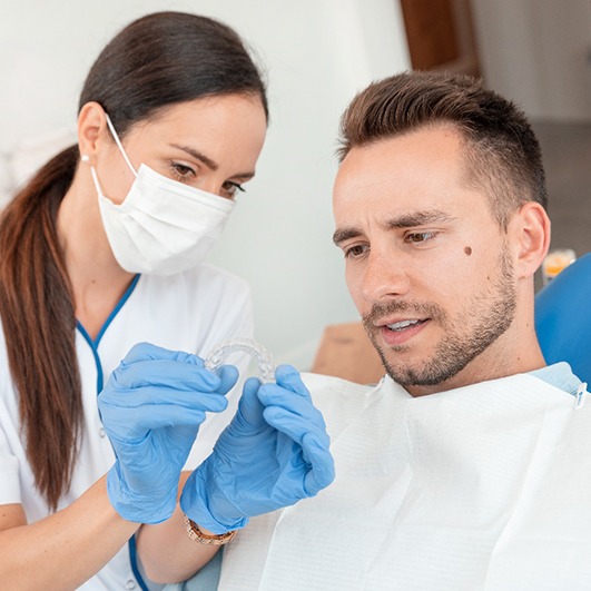 Man at dentist getting Invisalign