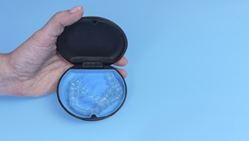 Invisalign aligners in a blue case