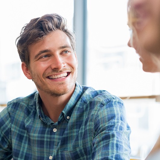 man smiling after getting smile makeover in Brick Township