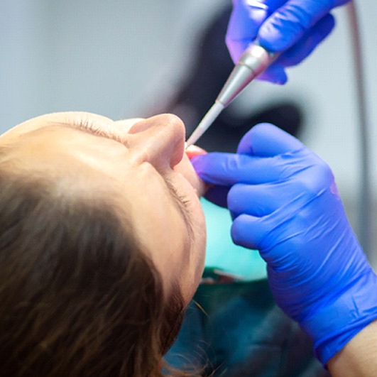 Woman having her teeth worked on with oral conscious sedation in Brick Township, NJ