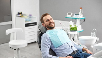 Male dental patient smiling after oral conscious sedation in Brick Township, NJ