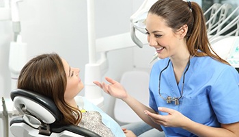 young woman chatting with her dental hygienist 