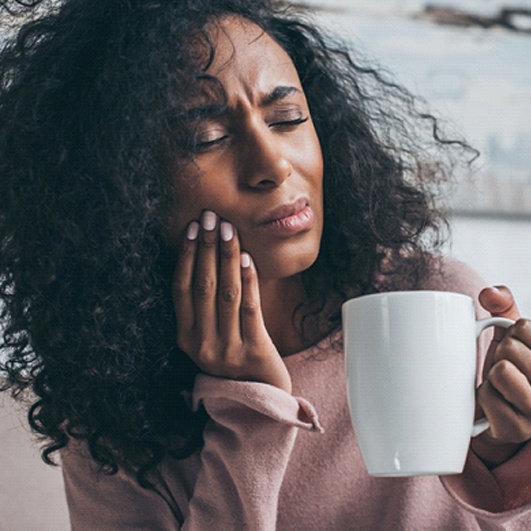 woman coffee toothache for root canal therapy in Brick Township
