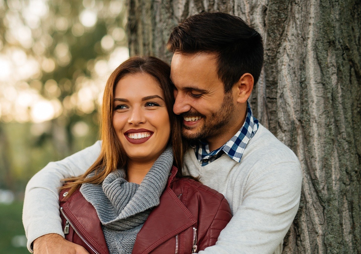 Couple smiling outdoors