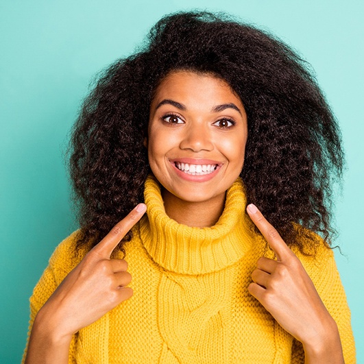 a woman happy about cost of teeth whitening in Brick