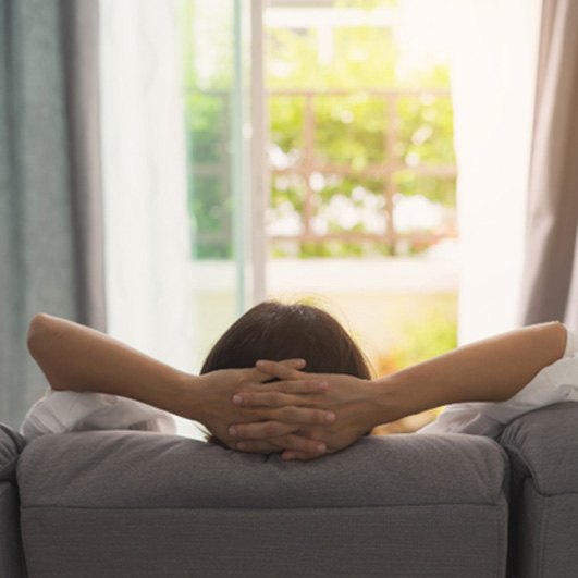 Woman resting at home after wisdom teeth extraction in Barnegat, NJ