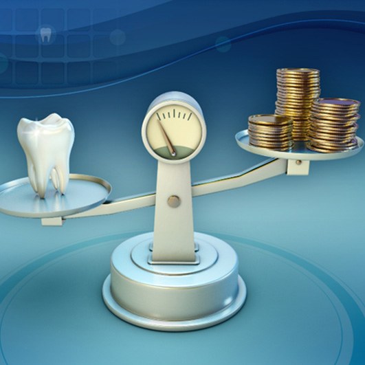 Tooth and coins on a balance scale