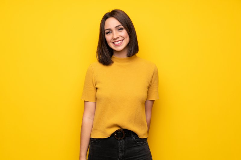 person with dental implants smiling 