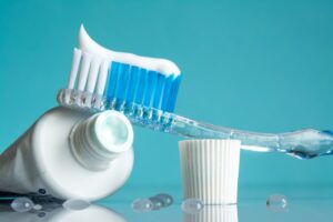 Toothbrush and toothpaste pictured.